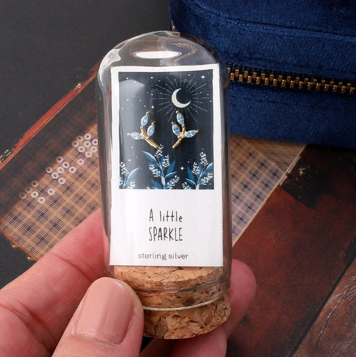 A Little Sparkle Gold/Blue Leaf Earrings in Bottle